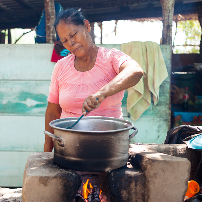 Local women have a small restaurant and cook for the surfers at a remote legendary local surf spot. Photo Courtesy of Two Feet and Classy