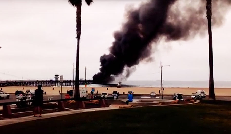 The smoke plume from the fire billowed high into the air, attracting onlookers to the blaze.