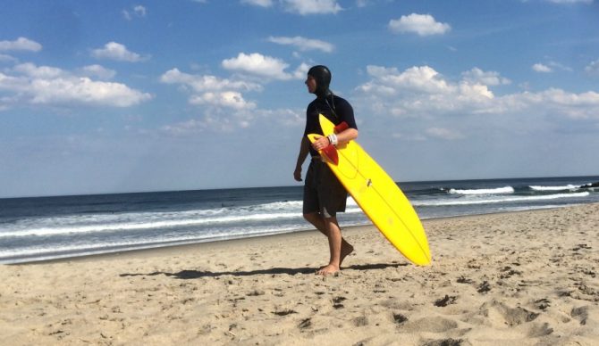 The author, taking advantage of the underused hooded short-arm rash guard in Asbury Park, NJ. Photo credit: @Ianherenow