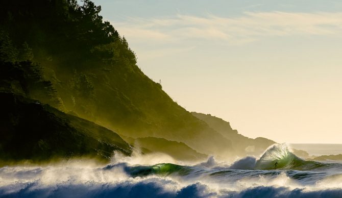 This shot, taken by Chris Burkard, actually won a Red Bull Illume contest for all categories as well as the “Illumination” category. The shorebreak was so big and the offshore plumes so high this day, that I missed most of the best waves, but finally a set came through. The light, the wind, and the swell were perfect. It was as if everything in nature fell into perfect harmony for this single moment. As Peter Mendia eased into this wave, the backwash hit, sending a golden shower of water 10-feet above his head, and sending him down the line of another 20-second barrel. Photo: BurkardPhoto.com