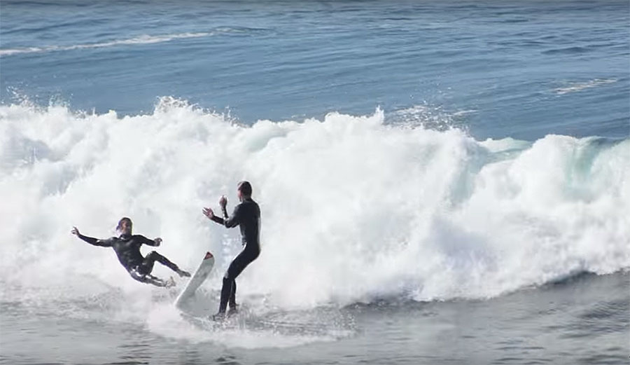 The drop-in offender takes it up a notch and, in what is a total dick move, actually tries to shove the guy he dropped in on off his board.