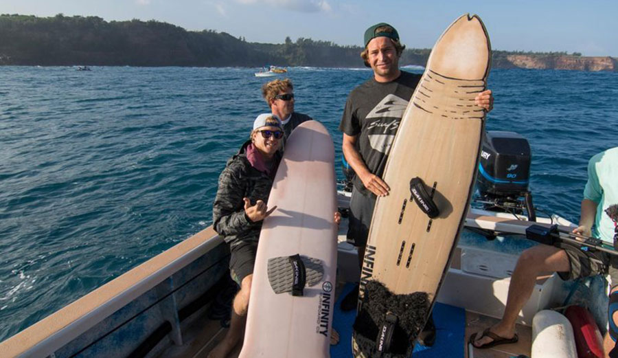 Jamie O'Brien's do-anything-guy, Poopies, looks half way comfortable, even on a dick-shaped board that Anastasia Ashley made.