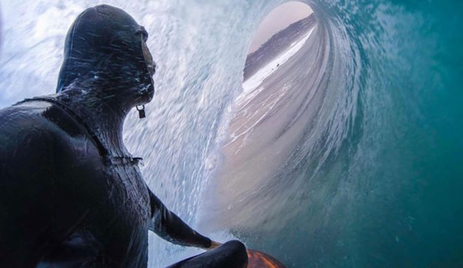 Cliff Kapono will spend the next 9 months traveling the world to discover whether surfers around the world are covered in unique bacteria that support their wellbeing. Photo: UC San Diego