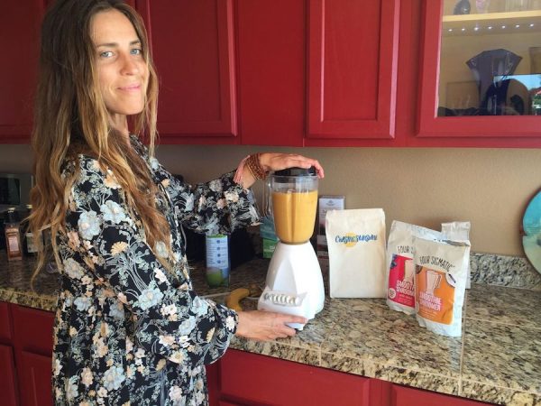 Megan mixes up a smoothie at B4BC's recent Chasing Sunshine Ocean Side Retreat. Photo: B4BC