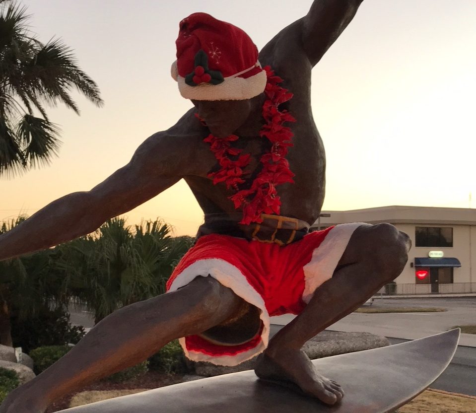Kelly Slater statue in Cocoa Beach dressed up for the holidays