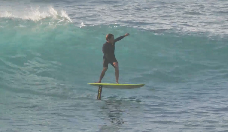 Kai on a hydrofoil, pumping his way between waves, it's got a little bit of supsquatching thrown in for good measure.