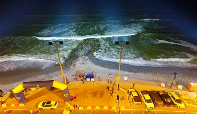 1,000 watt LED lights atop four 59ft posts now illuminate a stretch of beach in Lima, Peru. The hope is to extend beach activities past daylight hours, specifically surfing. Photo: Radio Capital