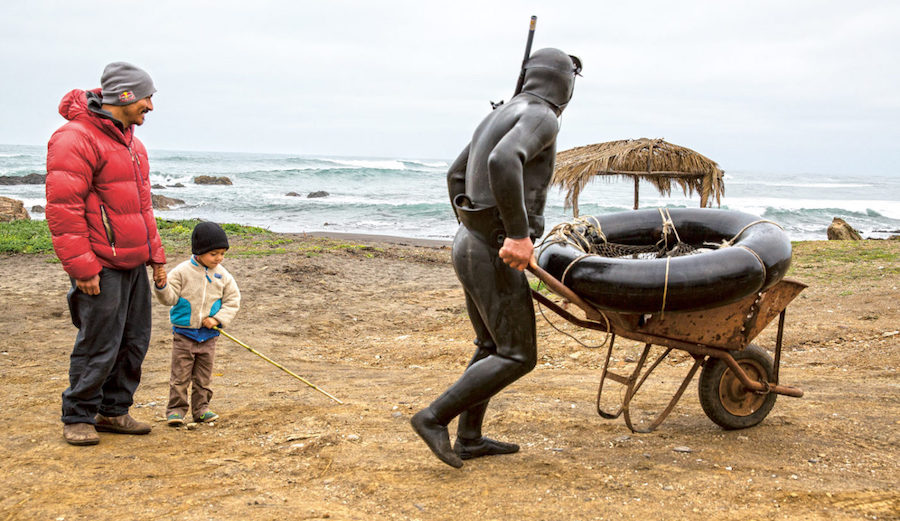 Ramon with his son and father. Pichelimu, Chile. Photo: Jeff Johnson