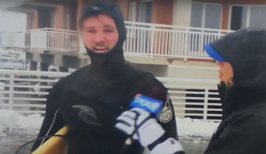 New York is in the middle of a decent Nor'Easter, so the news crew from PIX11 headed out to put a reporter in the middle of it. From behind a snow-covered storm berm, a lone surfer appears.