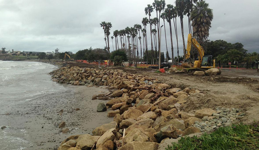Installing large boulders as rip rap to armor the shore against further erosion at Goleta Beach in Southern California. The tide is very low (negative). Daniel Hoover/U.S. Geological Survey