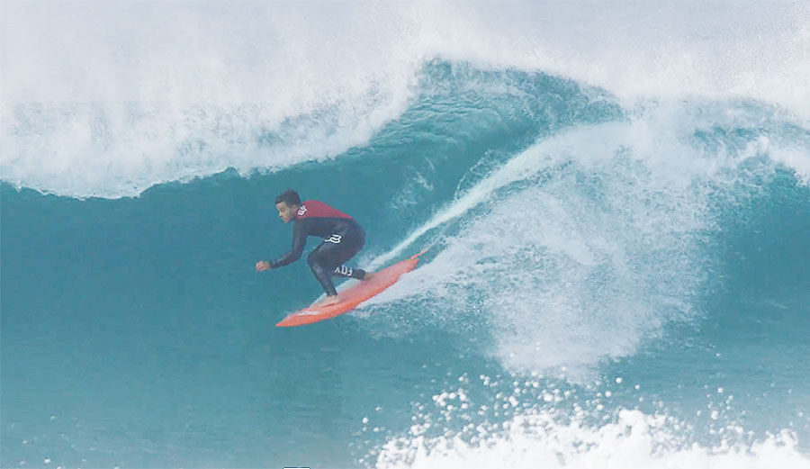 Keanu Asing on a single fin.