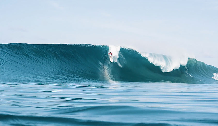 Matt Bromley is surfing a very large wave that was created after Indonesia's Boxing Day earthquake.