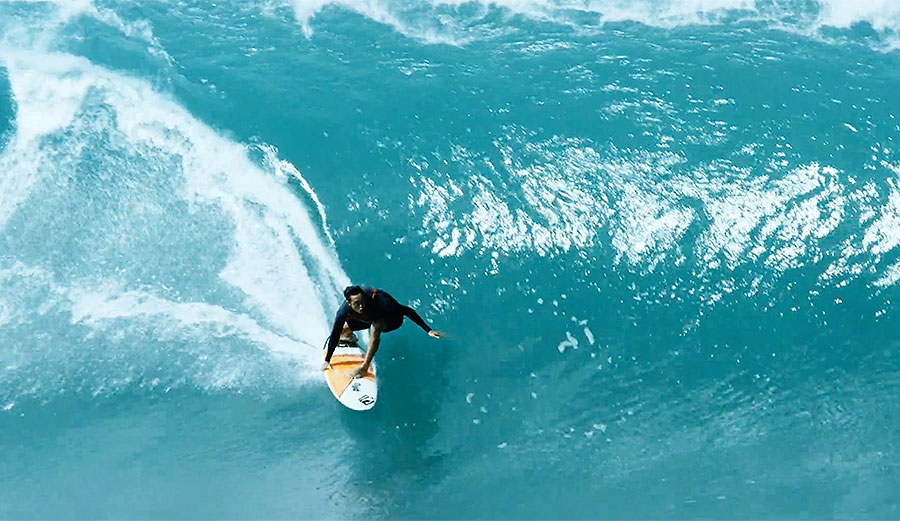 If you want to be one of the top guys on the North Shore, you can't just paddle out and get the wave of the day. You've got to train hard and put in your time, like Eli Olson.