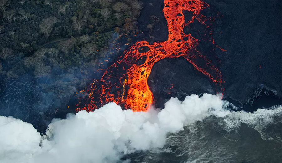 An aerial view of a massive surface flow entering the sea at Malama Flats, Hawai'i. Image: EPA/Bruce Omori/Paradise Helicopters