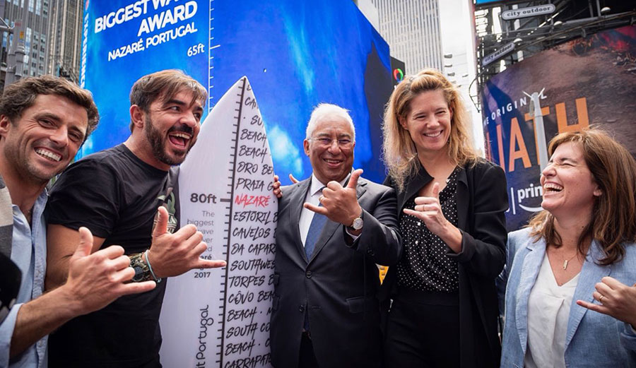 Ski driver Sérgio Cosme, Rodrigo Koxa, Prime Minister António Costa, WSL CEO Sophie Goldschmidt, and some very awkward-looking shakas.