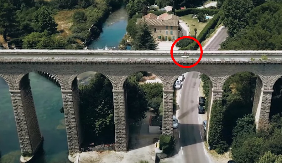 Frenchman Philippe Caneri hydrofoils across an aqueduct.