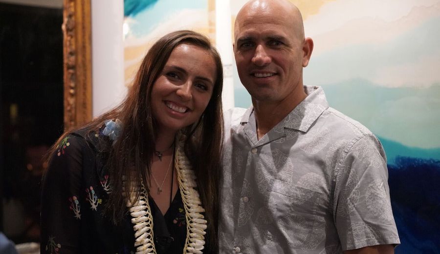 Taylor and Kelly Slater pose for a proud dad moment at Taylor Slater's first solo art show in Montauk. Photo: