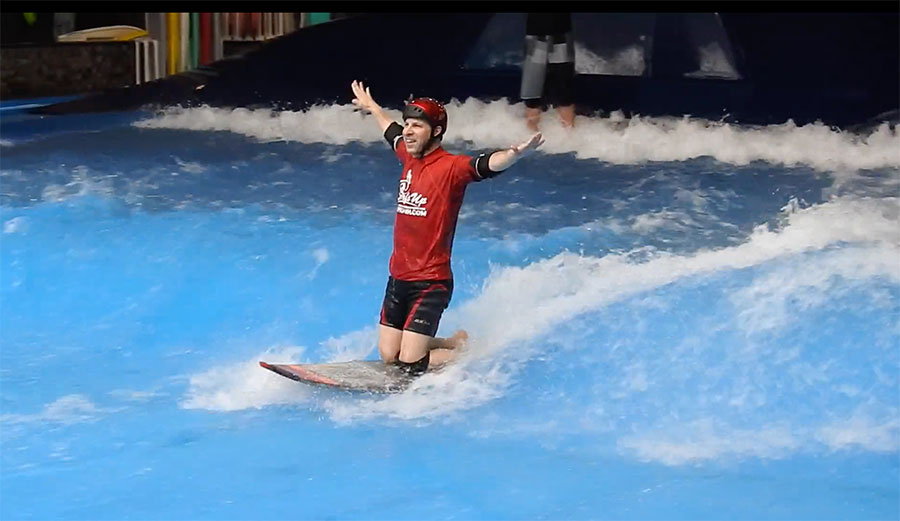 man at indoor surf pool