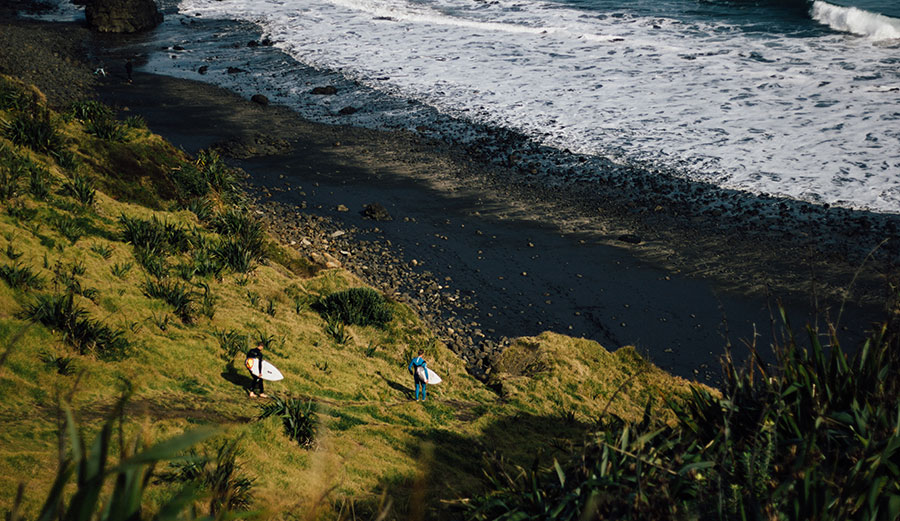 Surfers at Maori Bay, up the coast from the shootings.