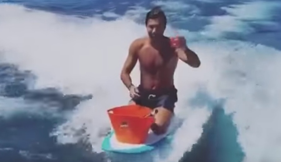 This man mixed a cocktail while wake surfing. Nicely done, sir! Photo: Youtube