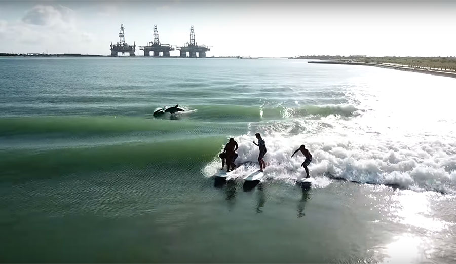 Jamie O'Brien Texas tanker waves with dolphins surfing