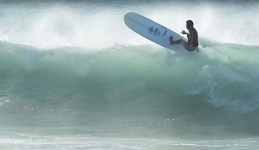 Kai Sallas longboard surfing in Hawaii
