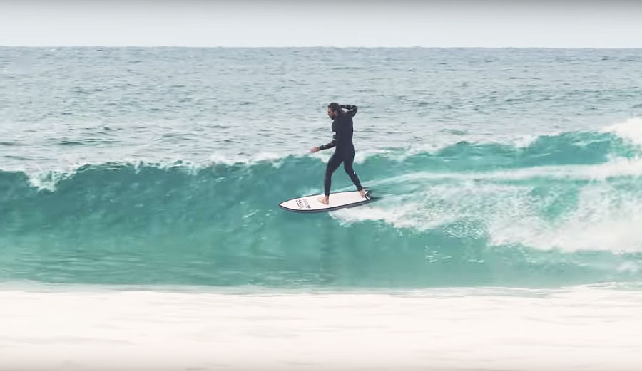 Fish surfboard on small waves