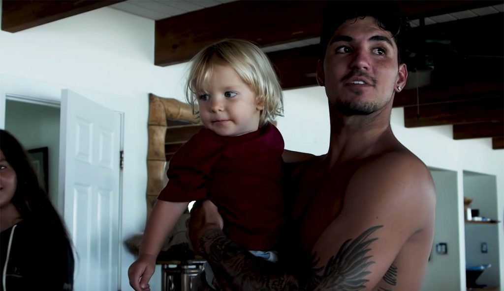 Gabriel Medina holding baby day of world title