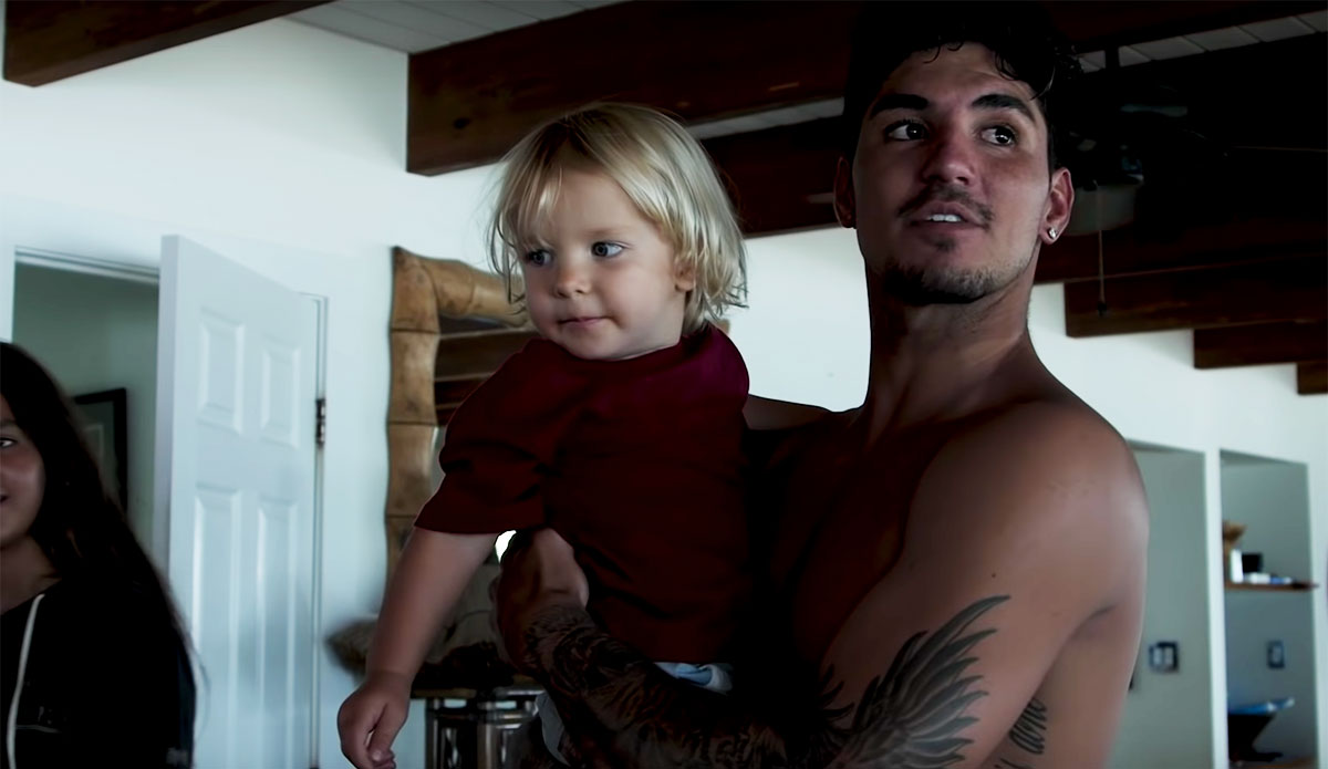 Gabriel Medina holding baby day of world title