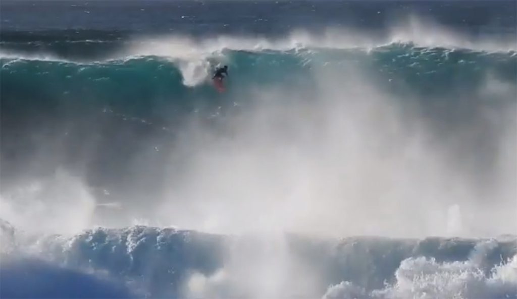 Mark Healey Surfs a Giant Wave at Pipeline in Hawaii