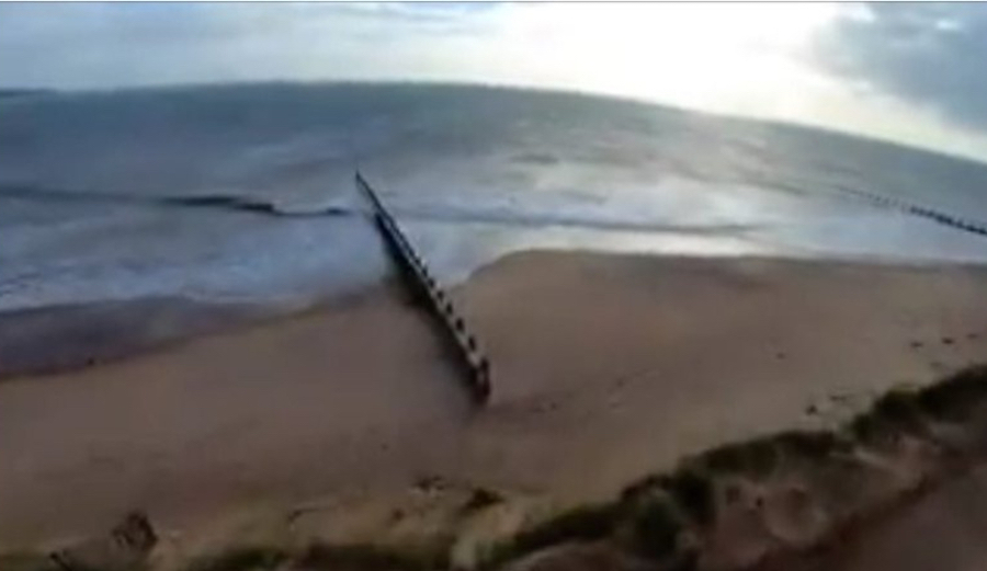 Pro kitesurfer Olly Bridge performed a 600+ foot jump over a sandspit that's mindblowing to watch.