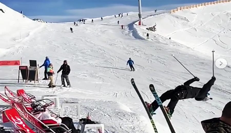 This guy backflips up to the ski resort bar
