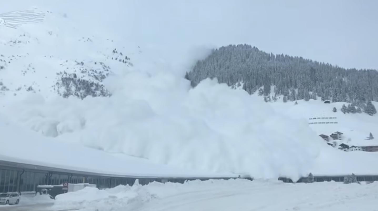 Man sitting in car in Davos, Switzerland gets buried by avalanche.