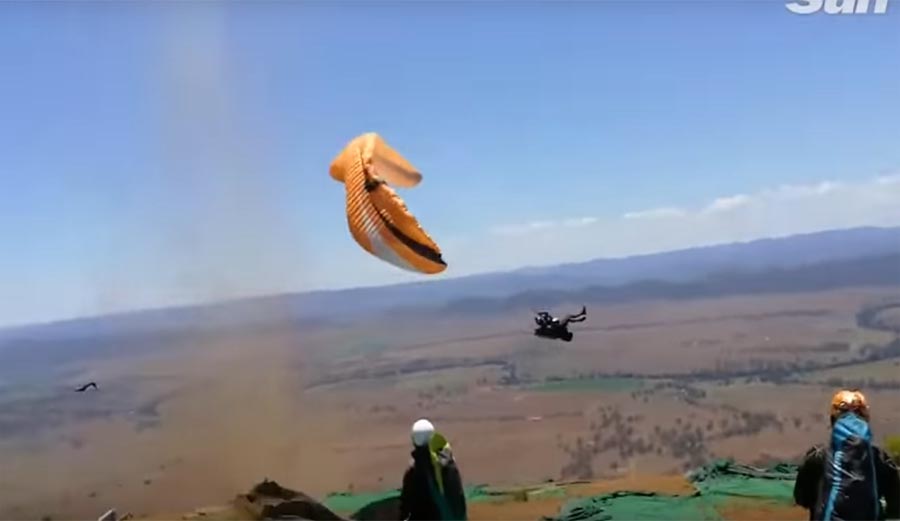 Dust Devil throws a paraglider around as he tries to launch.