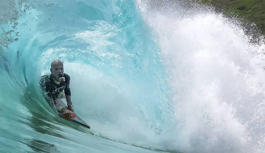 Marcus Biju surfing