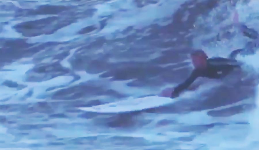 Pat Gudauskas with the one-armed, board assisted body surf to top turn.