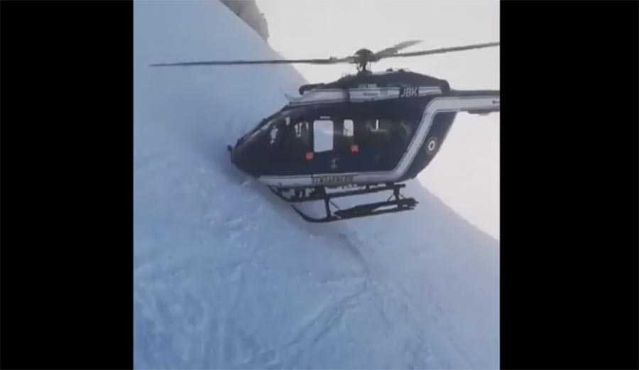 Helicopter makes dangerous high-mountain rescue near Chamonix, France.