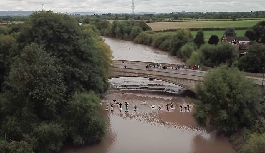 Severn river tidal bore surfers