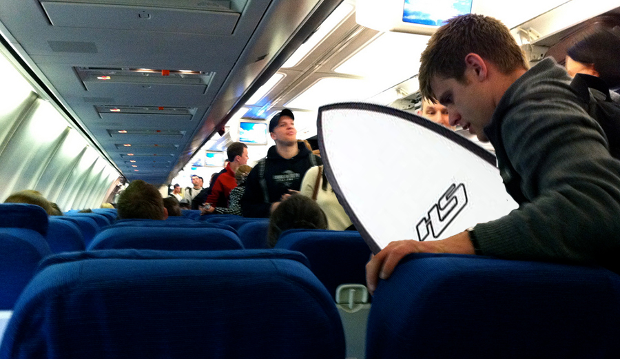 Photoshopped traveler with surfboard