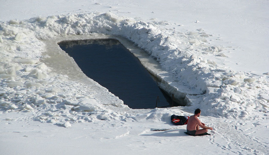 Man swimming in cold water