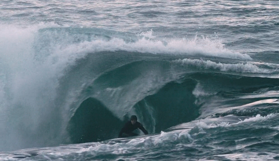 Sandy Kerr surfing in the North Sea