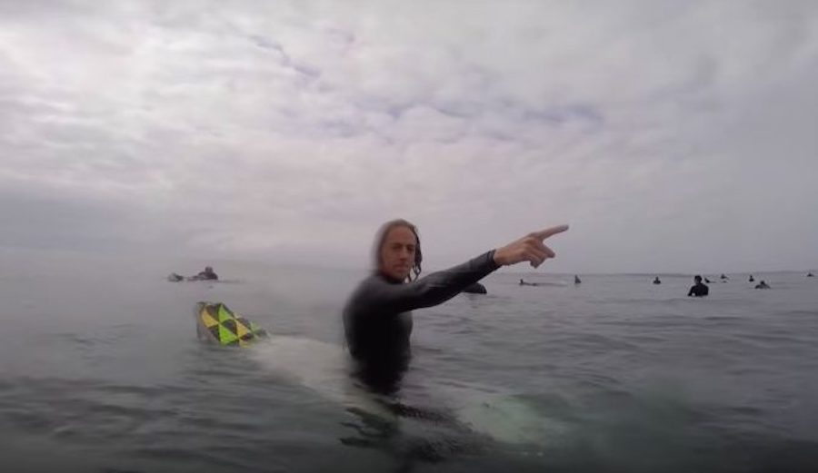Guy pointing surf lineup
