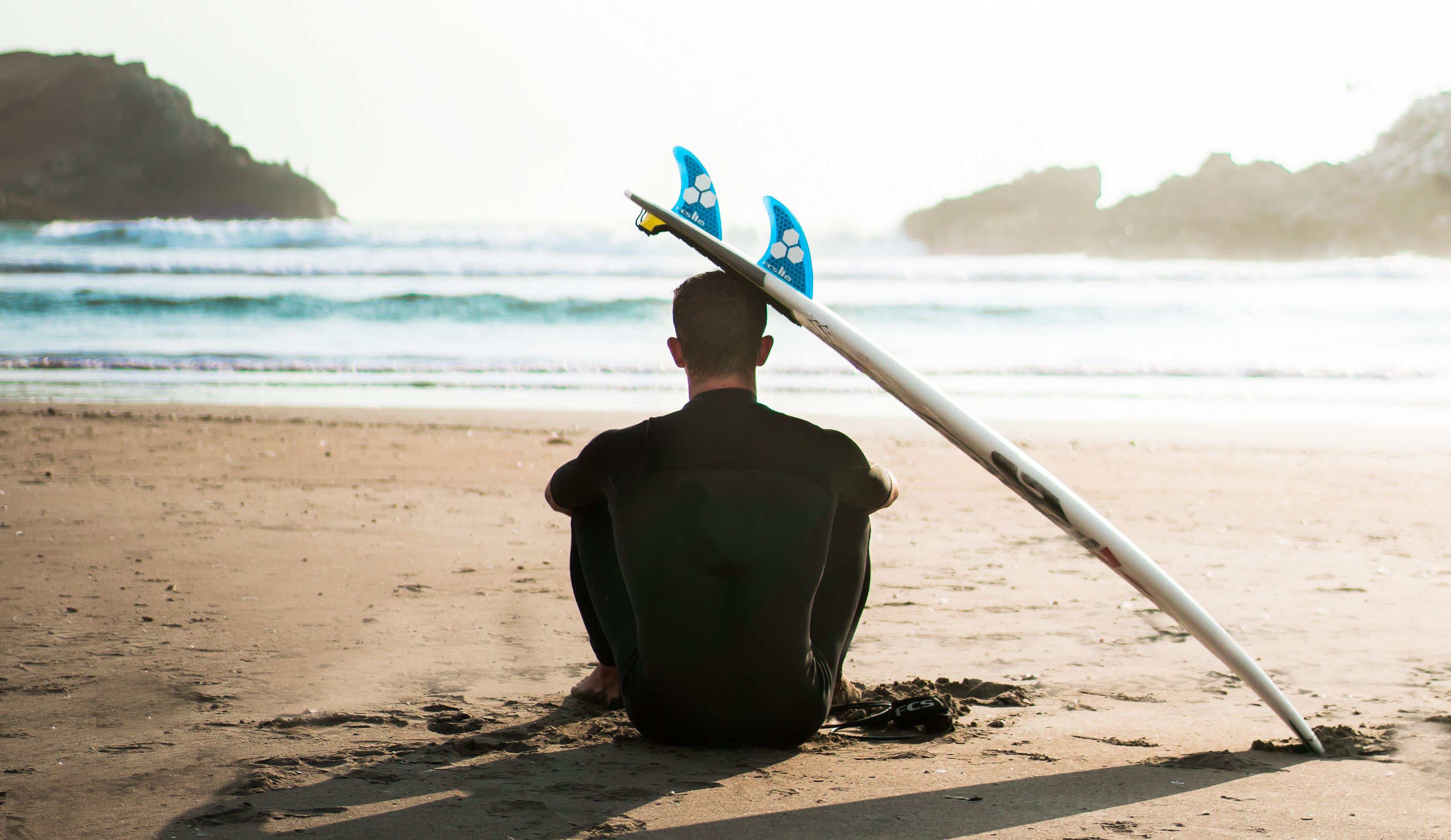 So...what's the true cost of being a surfer for a year? Photo by Sebastián León Prado on Unsplash