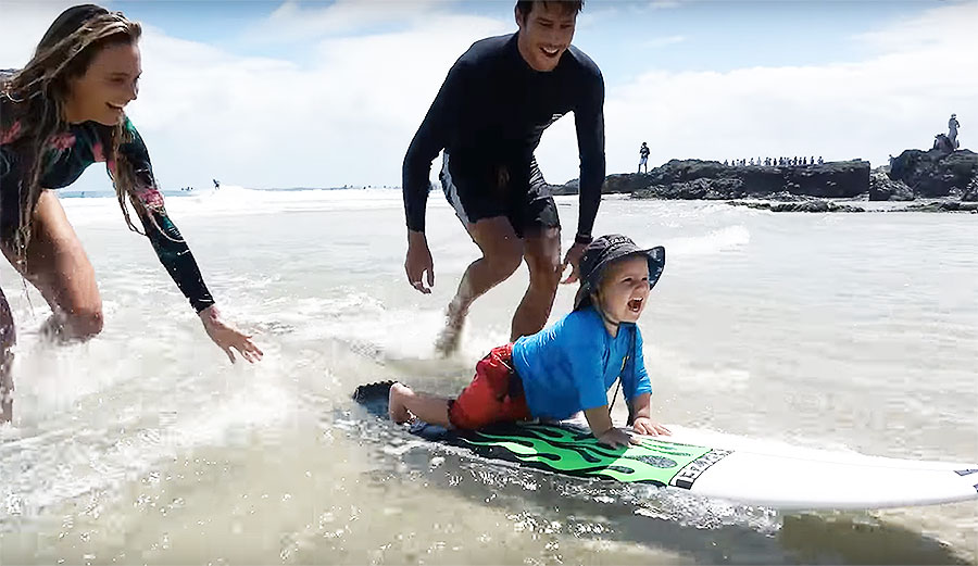 Alana Blanchard baby surfing