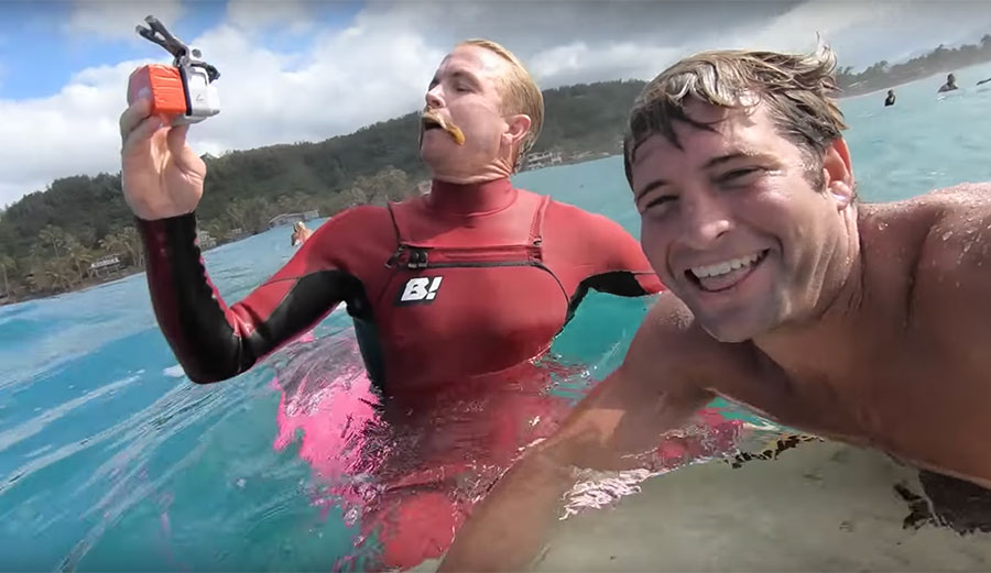 Jamie O'Brien and Poopies surfing Pipeline