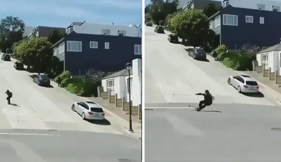A skateboarder wrecks on a steep hill sliding yards on the concrete