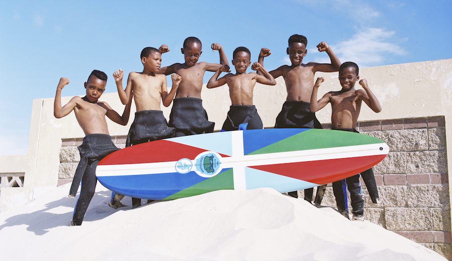 The kids of Harper, Liberia may be new to surfing but it's giving them a new lease on life. Photo: Mami Wata