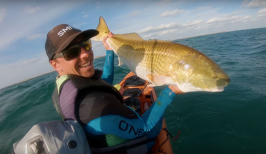 Brett Barley kayak fishing for bull red drum fish
