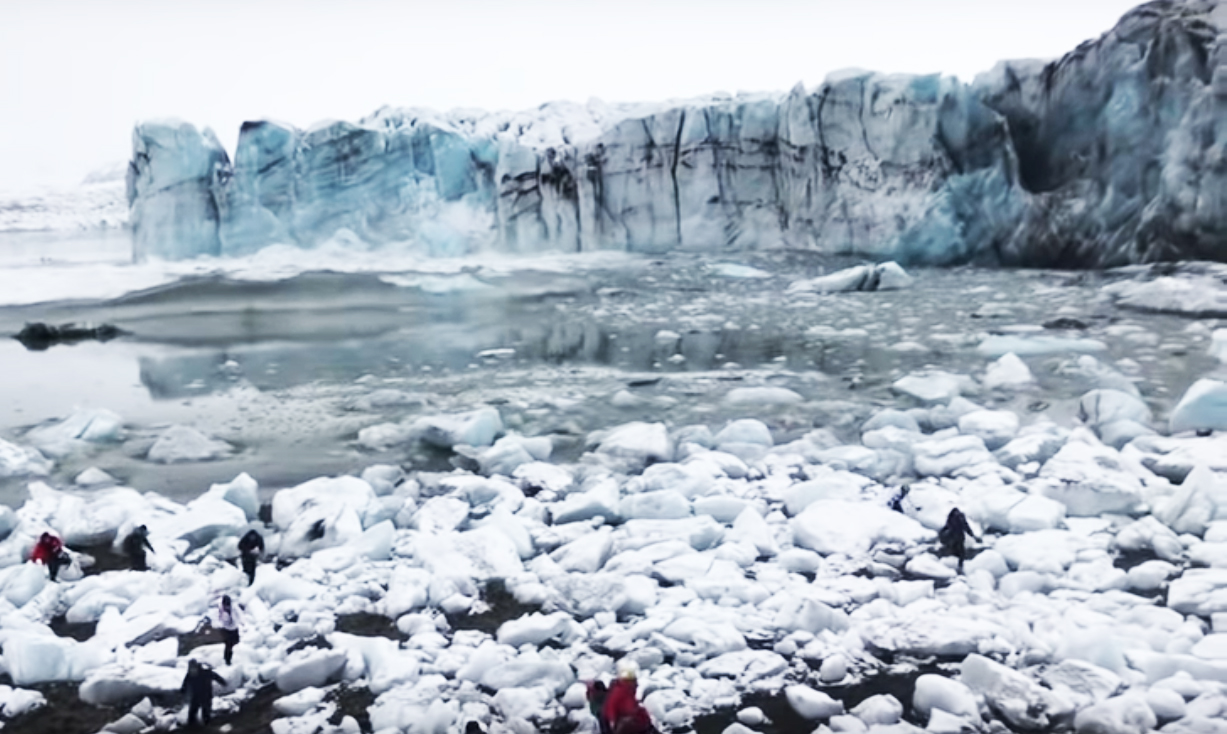 Waves from a calving glacier almost take out tourists in Iceland