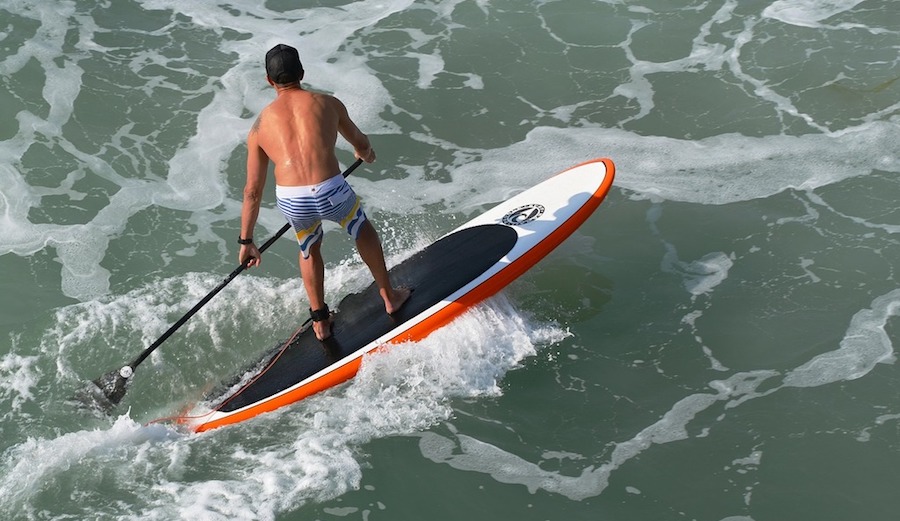 Surfing paddle board ocean, travel vacation.